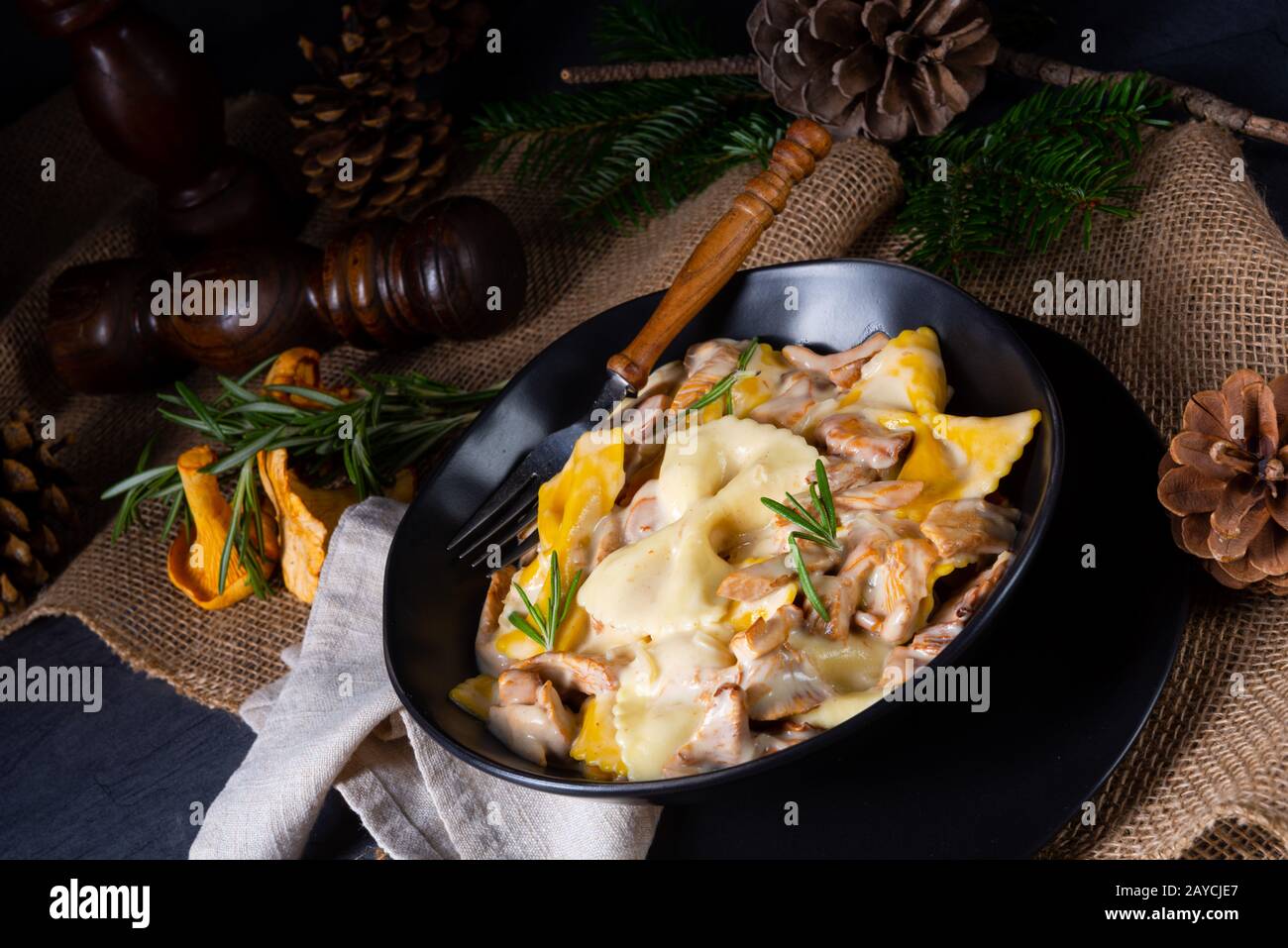 Colorful farfalle pasta with chanterelles and cream sauce Stock Photo