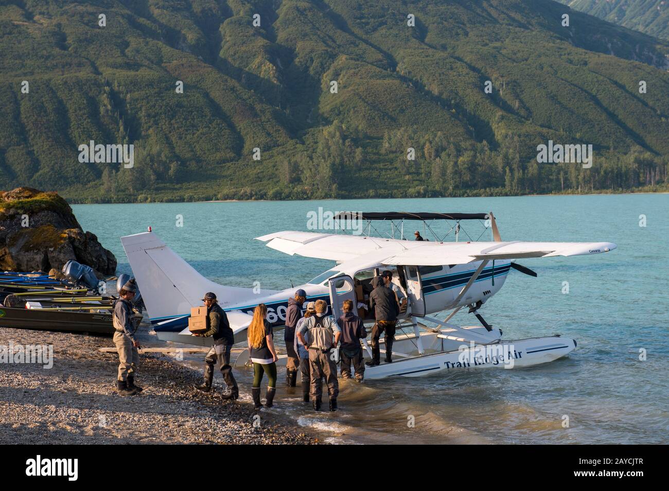 A seaplane is being unloaded at the Redoubt Mountain Lodge on Lake Crescent in Lake Clark National Park and Preserve, Alaska, USA. Stock Photo