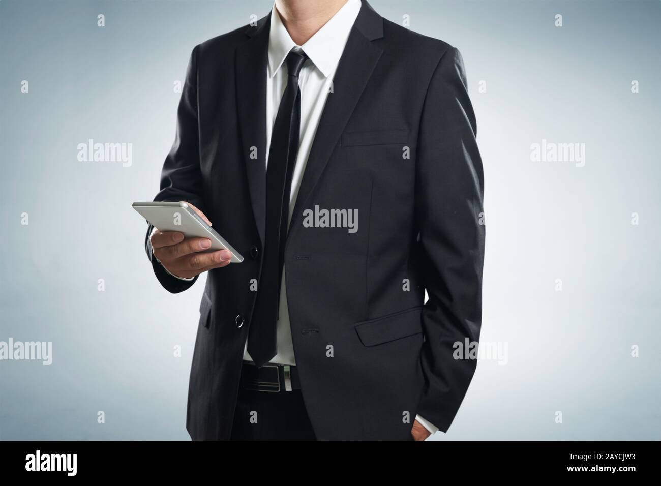 Close up of a businessman man using mobile smart phone Stock Photo