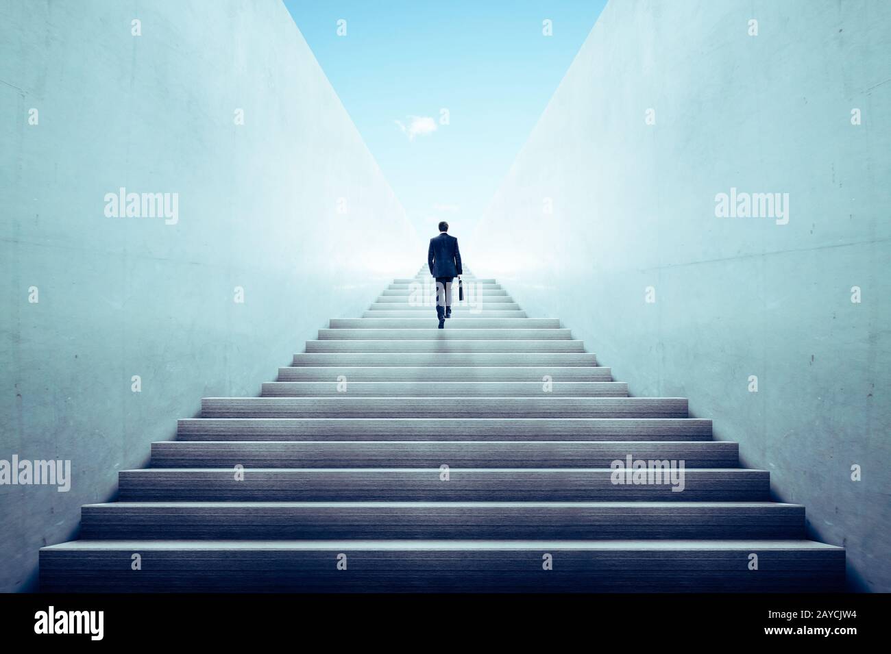 Ambitions concept with businessman climbing stairs Stock Photo
