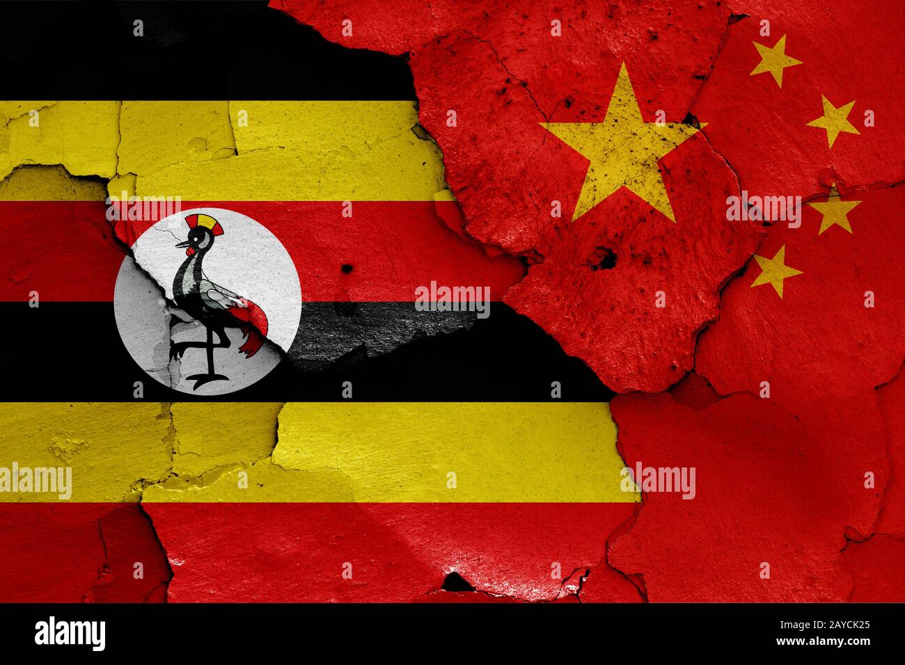flags of Uganda and China painted on cracked wall Stock Photo