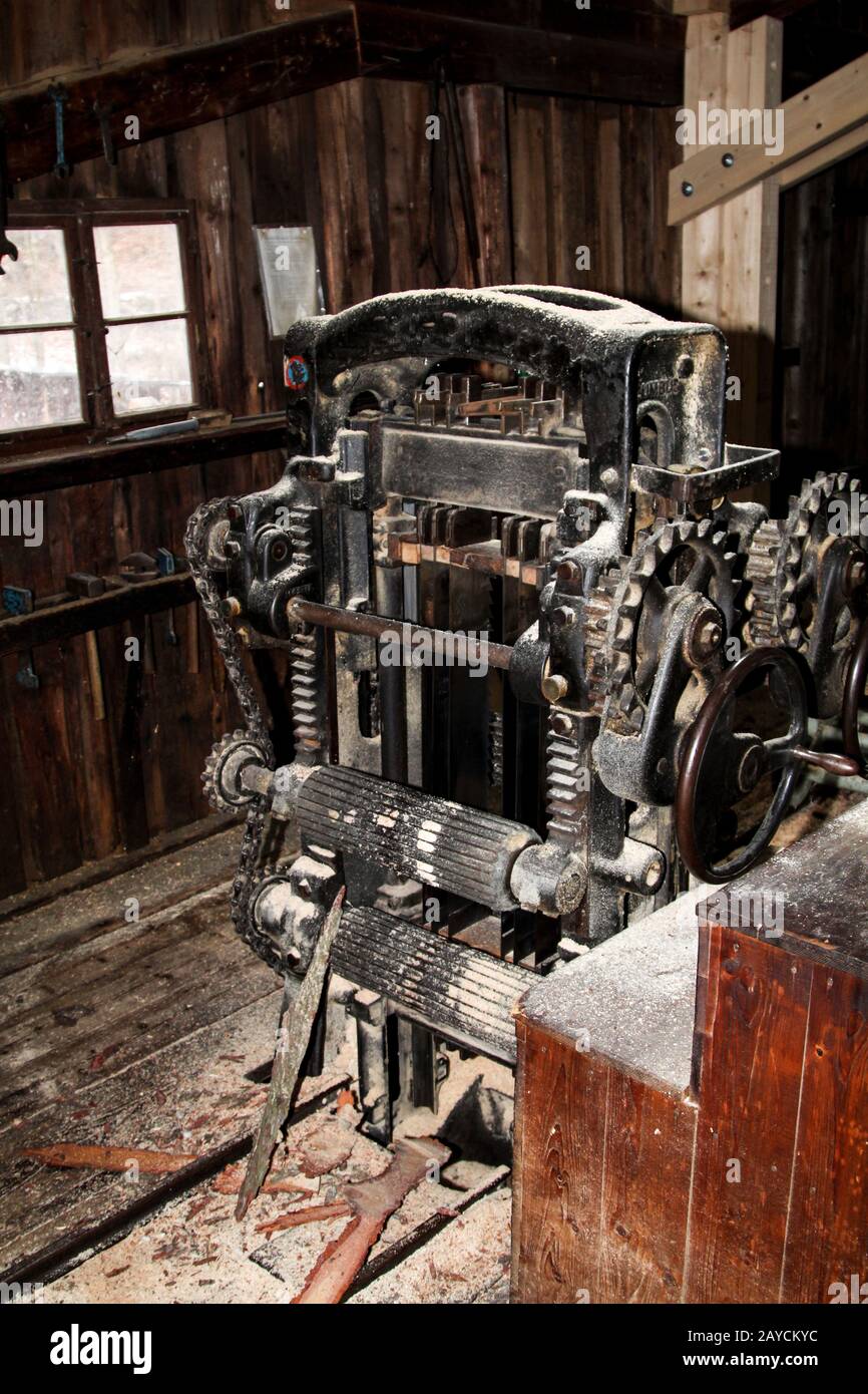 a machine for sawing wood logs out of tree trunks Stock Photo