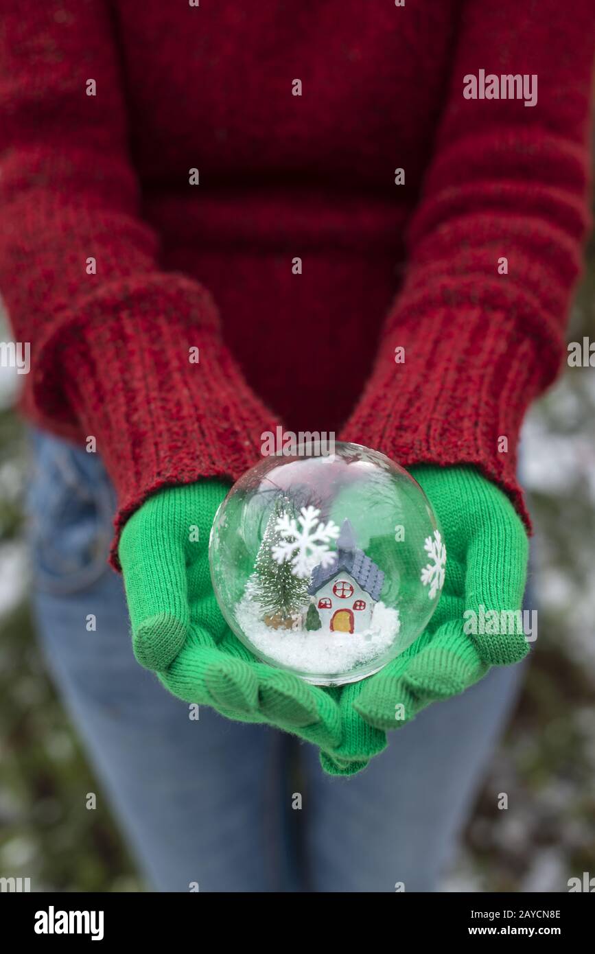 Crystal christmas ball with house and snow inside. Stock Photo