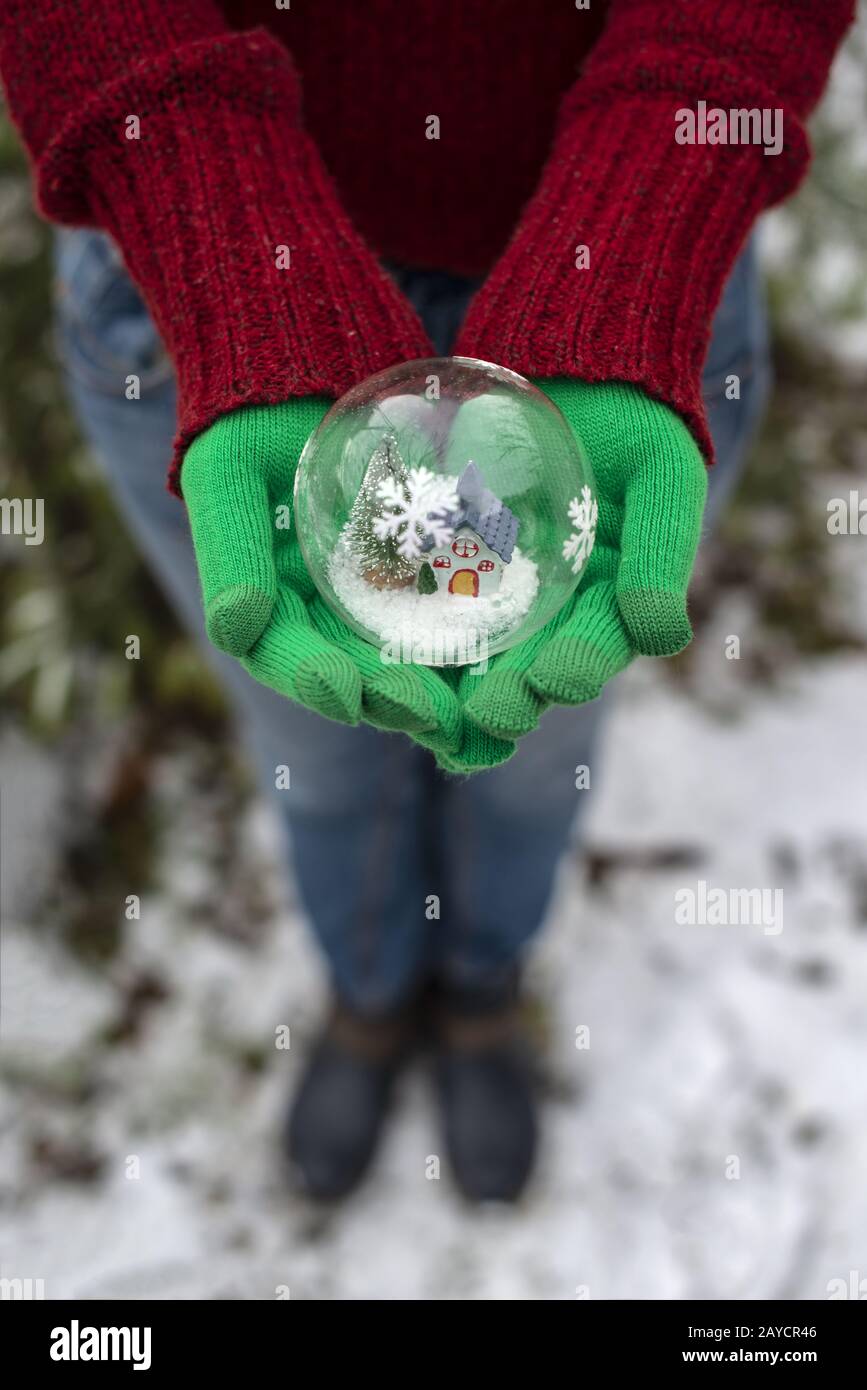 Crystal christmas ball with house and snow inside. Stock Photo