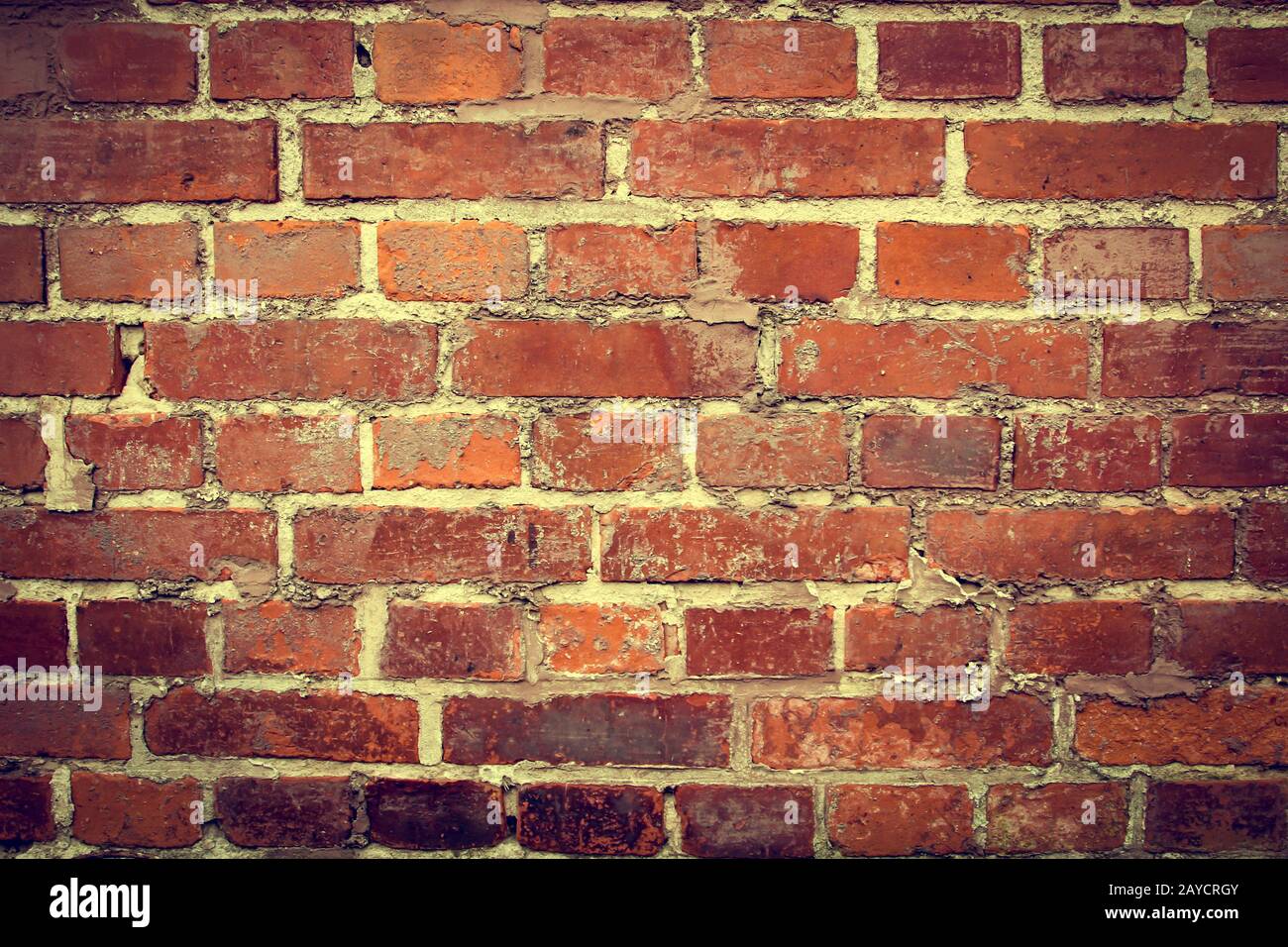Weathered stained old brick wall background Stock Photo