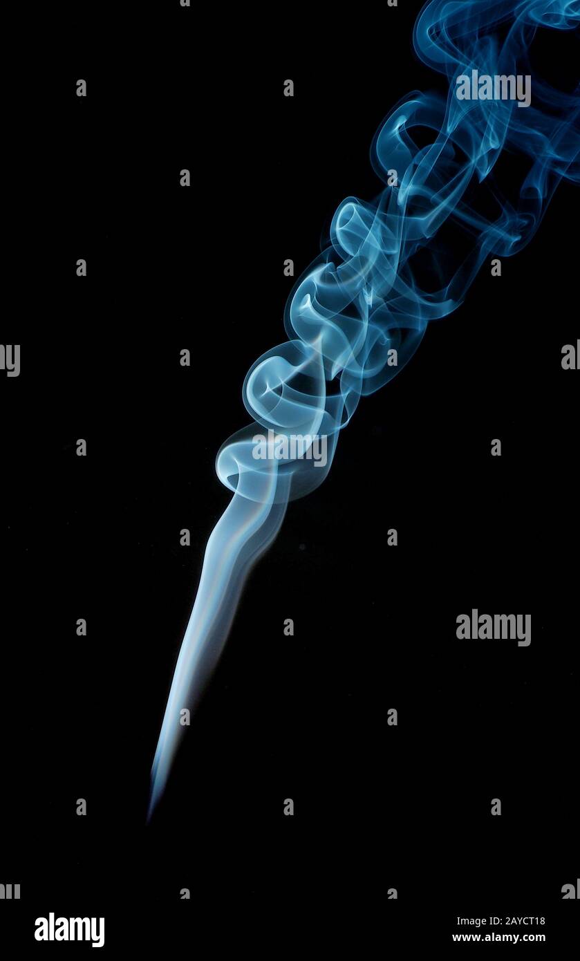 Abstract smoke in blue on a black studio background Stock Photo - Alamy