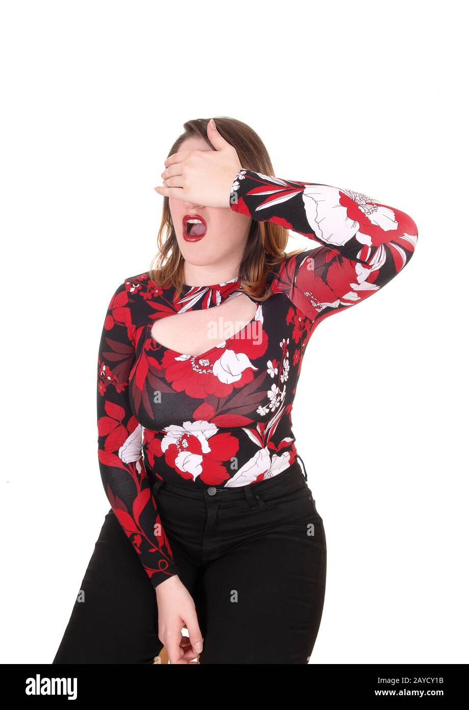 Woman screaming with her hands over her eyes Stock Photo