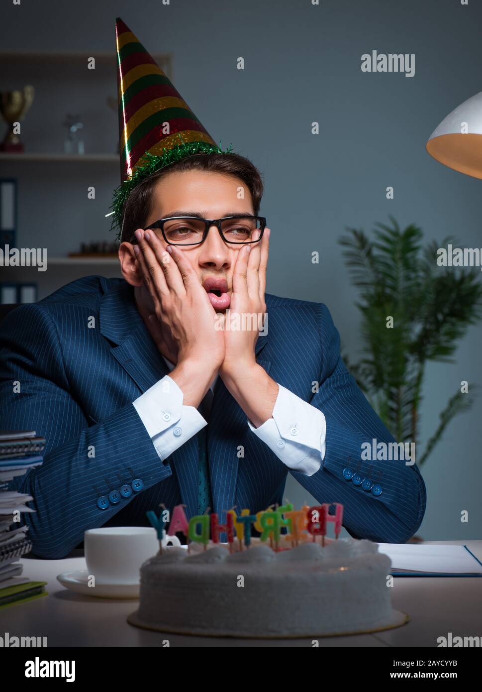 Man celebrating birthday in the office Stock Photo