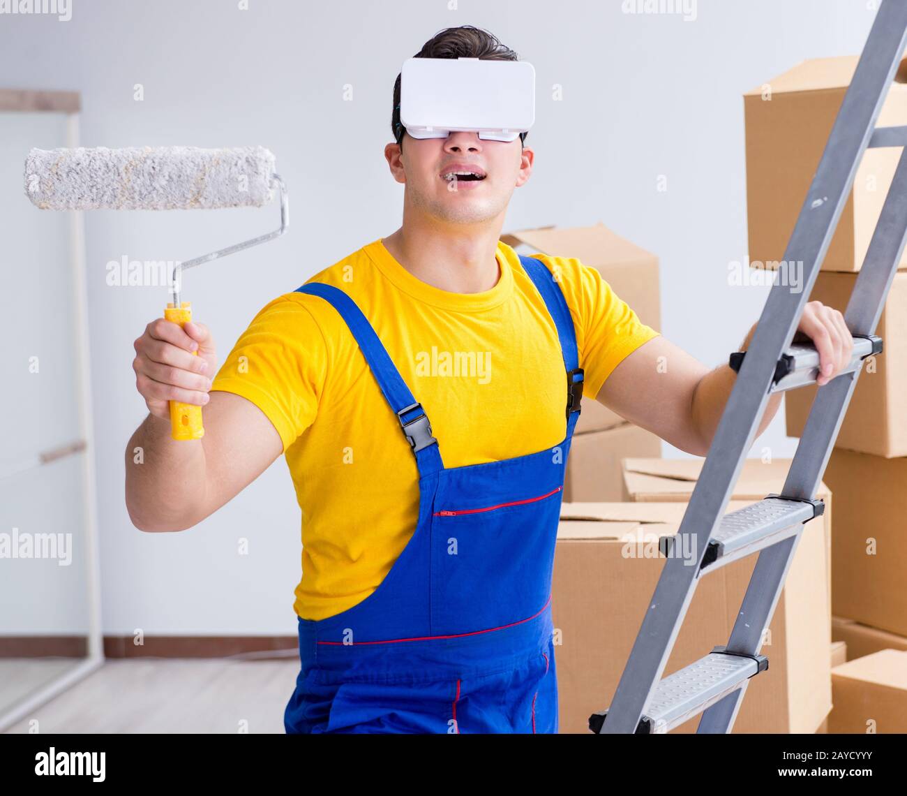 Painter contractor working with virtual reality goggles Stock Photo