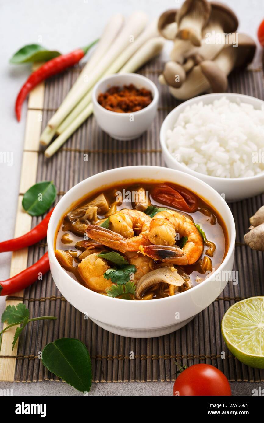Tom Yum Goong spicy Thai soup with prawns, coconut milk and mushrooms
