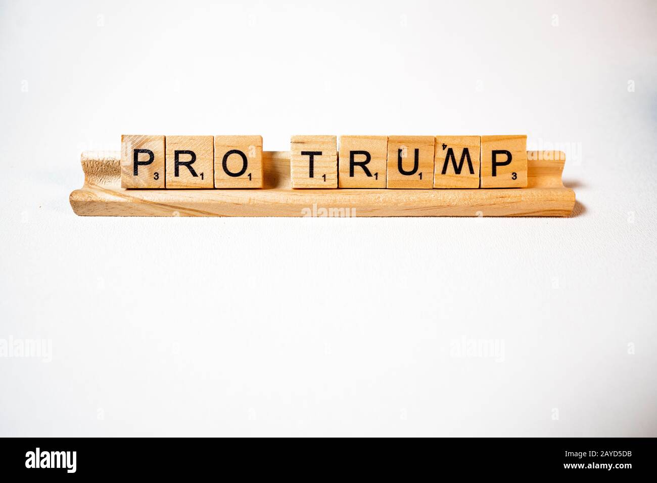 White background scrabble pieces spell pro Trump Stock Photo
