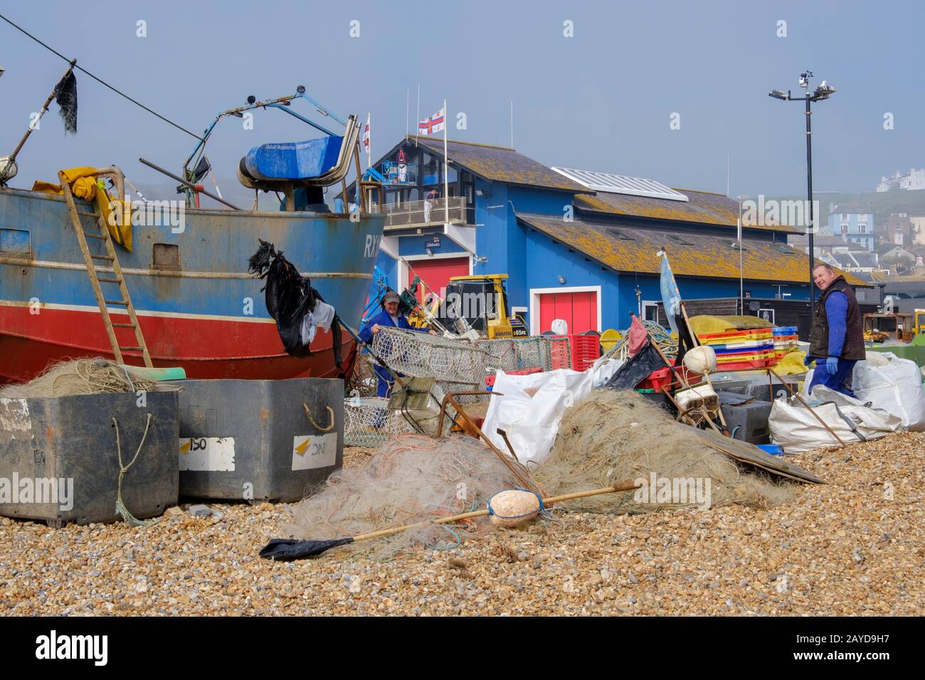 Fishermen and fishing boats on the Old Town Stade at Rock-a-Nore, Hastings, East Sussex, UK Stock Photo