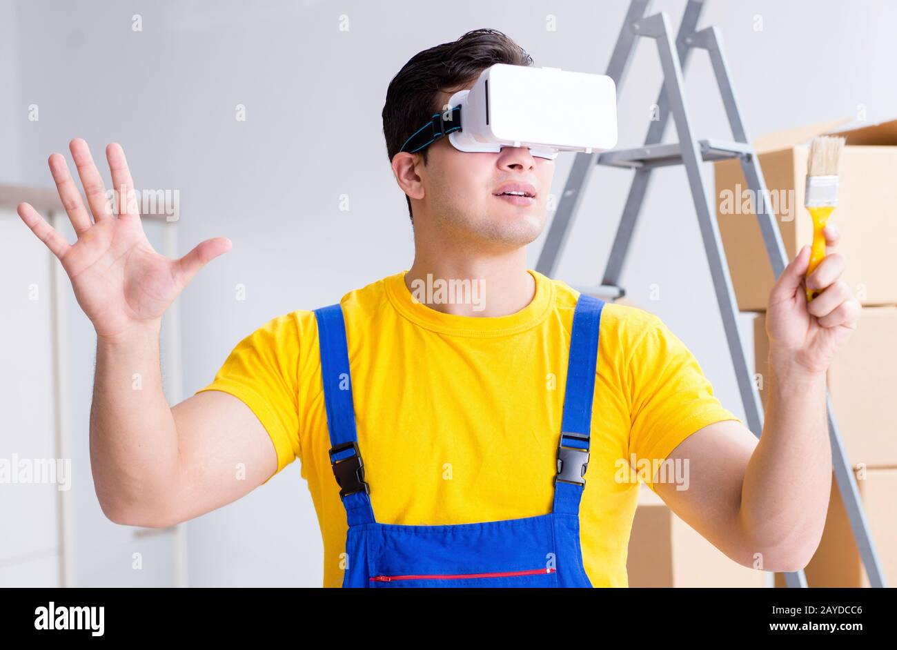 The painter contractor working with virtual reality goggles Stock Photo