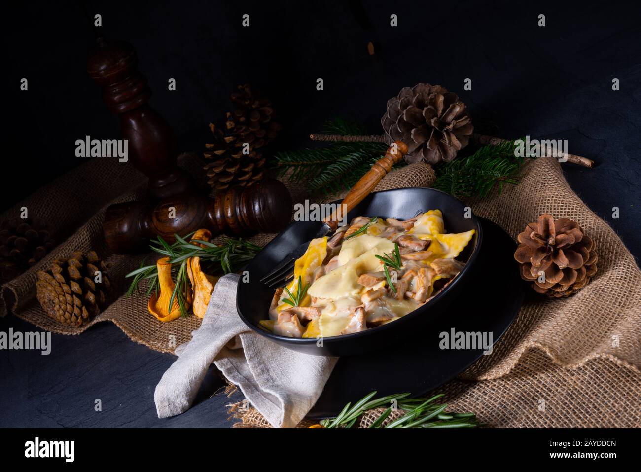 Colorful farfalle pasta with chanterelles and cream sauce Stock Photo