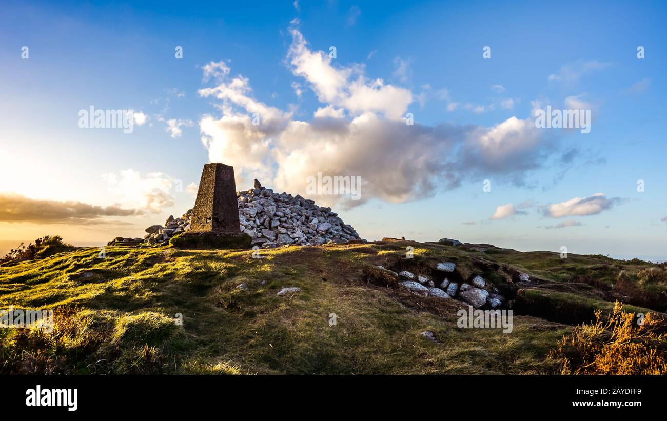 Sunset at Ticknock hill in Wicklow mountains with monument, golden hour, Ireland Stock Photo