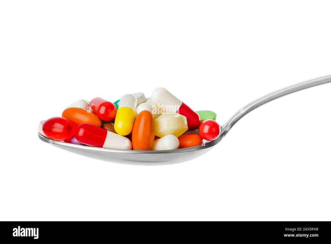 Spoon with pills Stock Photo