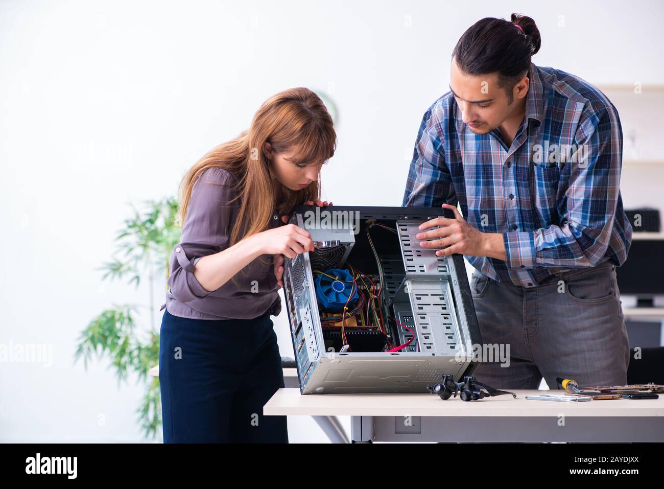 Two repairmen repairing desktop computer Stock Photo - Alamy