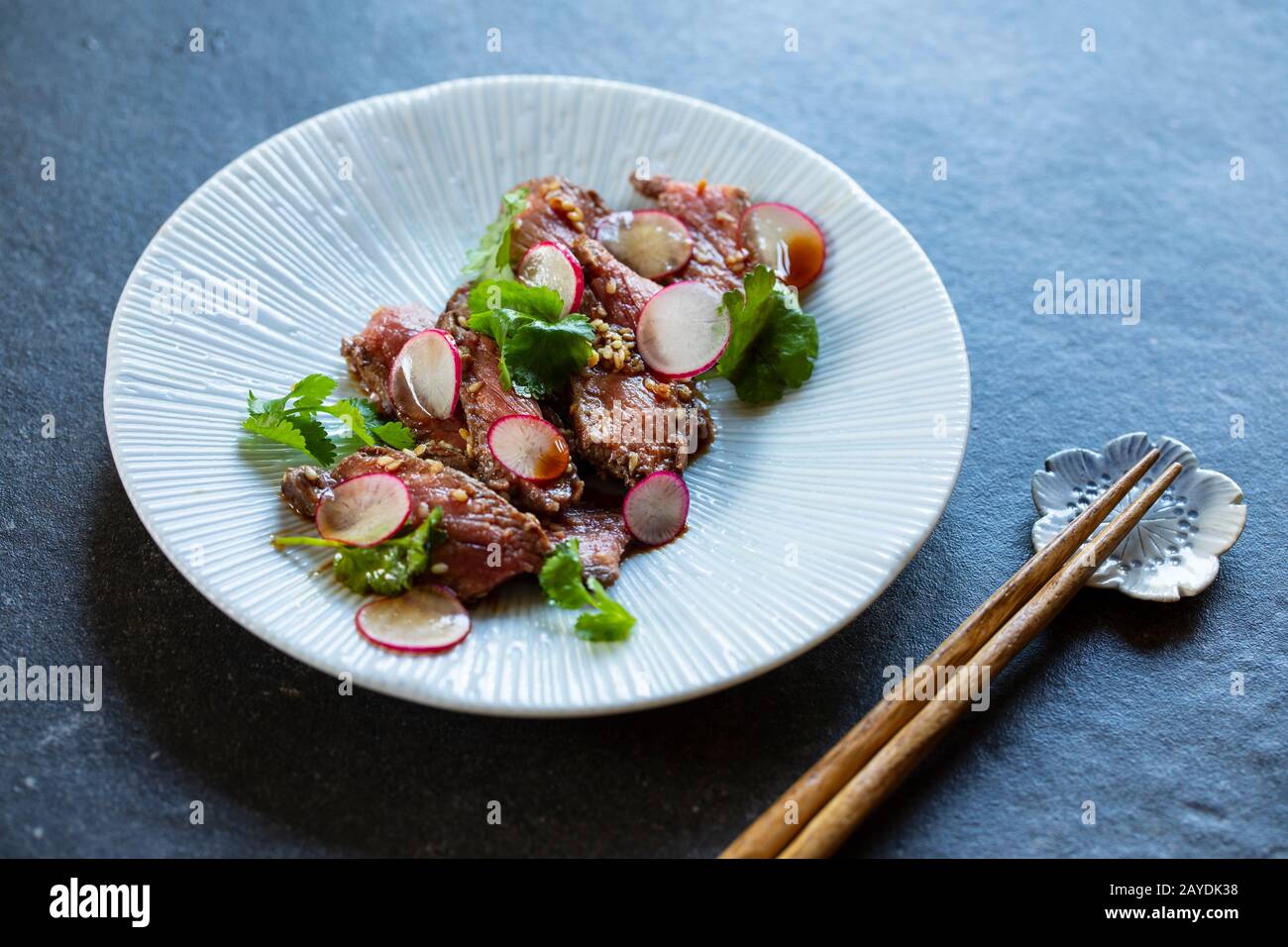 Japanese style beef tataki with radish and coriander Stock Photo Alamy