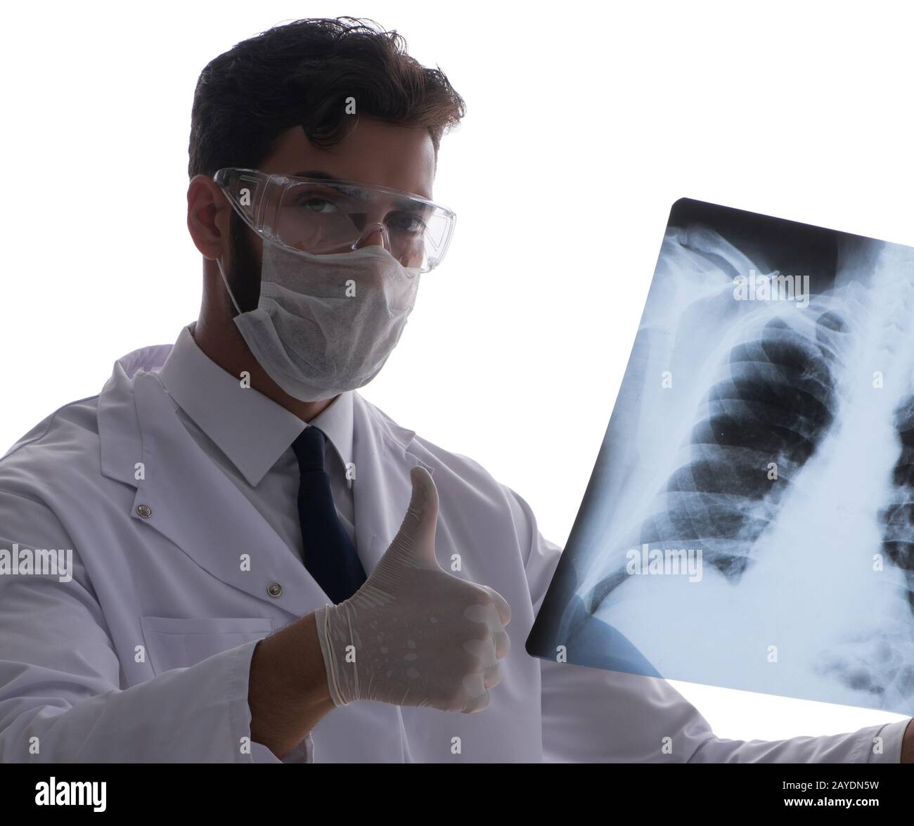 Young doctor looking at x-ray images isolated on white Stock Photo - Alamy