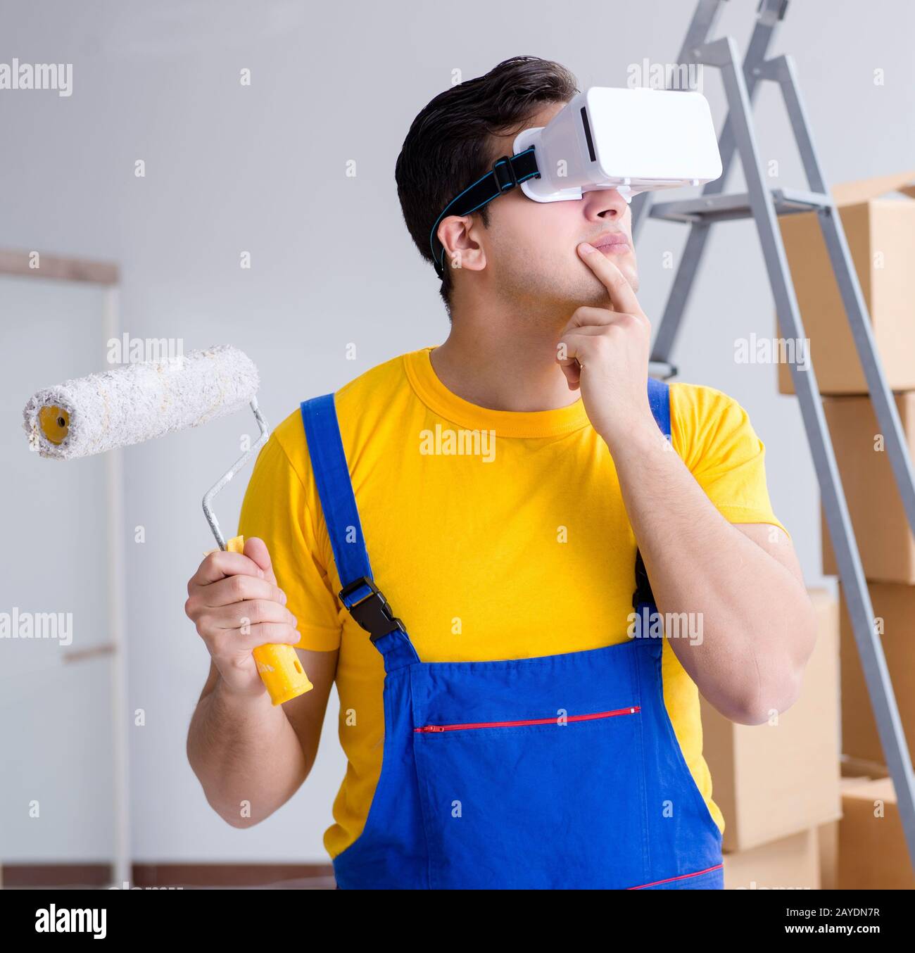 The painter contractor working with virtual reality goggles Stock Photo