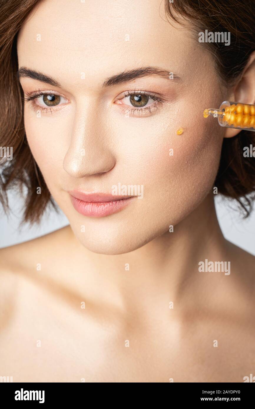 Close up of pretty female that doing morning procedure Stock Photo
