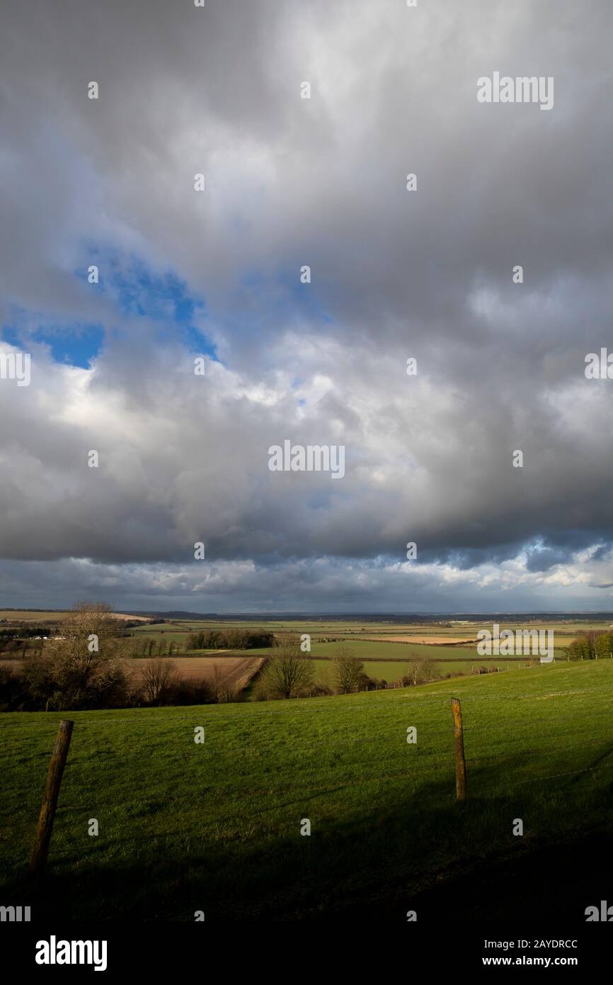 Rain clouds over farmland fields in the rural county of Hampshire Stock Photo