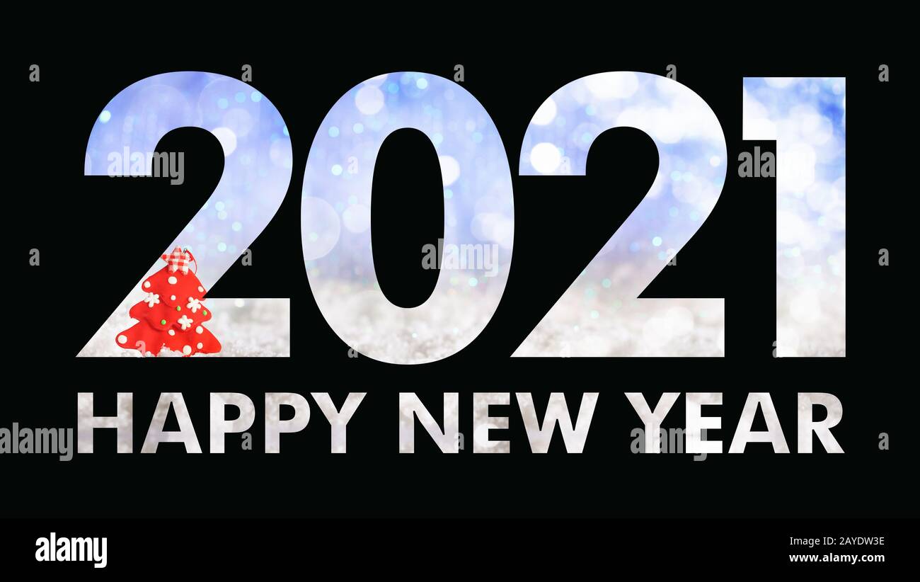 2021 New year eve. Black paper cut out number 2021 layer against Christmas ornaments on blue snowy bokeh background. Happy new year text, greeting car Stock Photo