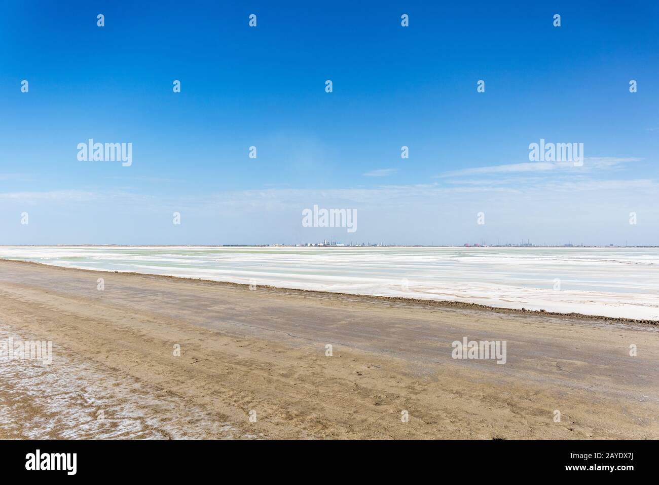 salt lake industrial landscape and dirt road Stock Photo