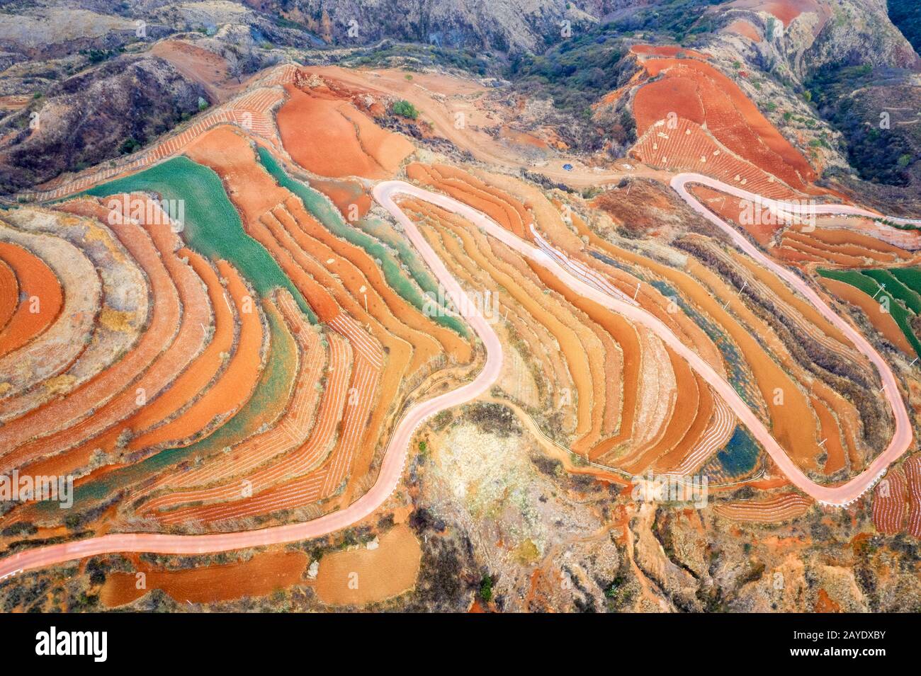 aerial view of red land and winding path Stock Photo