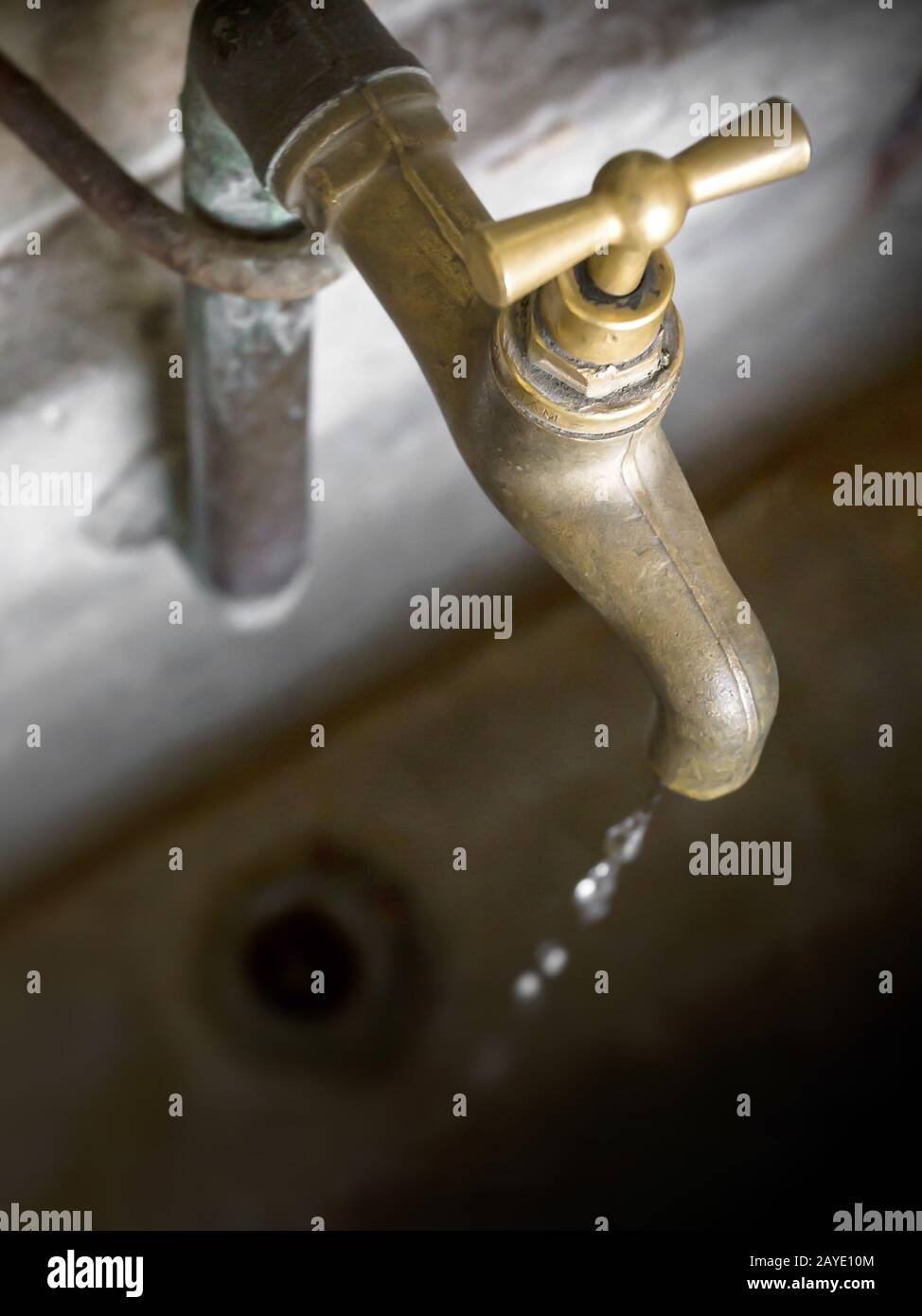 Old leaky dripping faucet Stock Photo