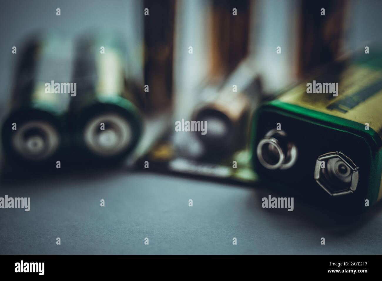 Different types of batteries on the dark table close-up Stock Photo