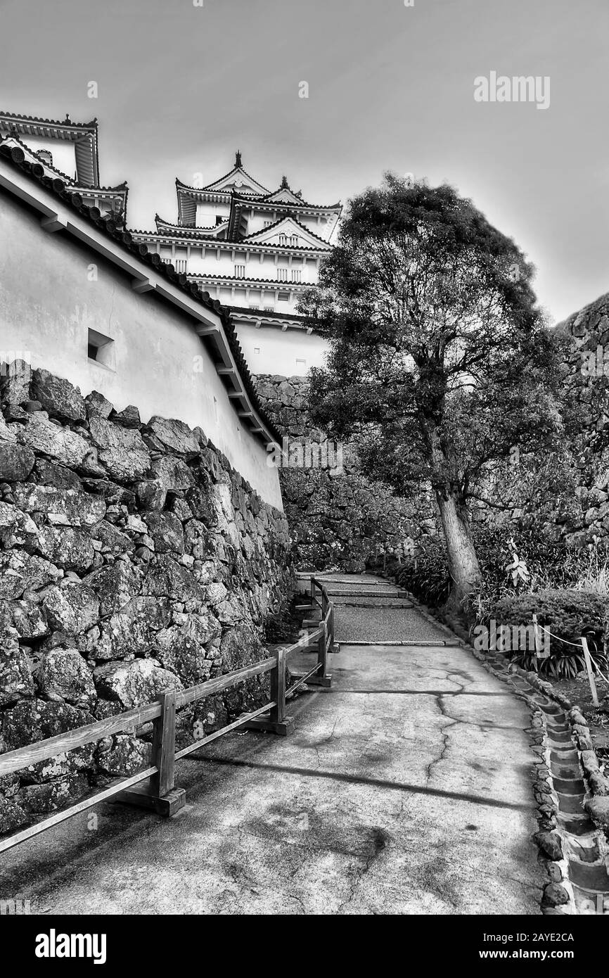 Dramatic Black White Architecture Of Historic Japanese Castle In Himeji City Under Clear Sky Between Stone Walls Stock Photo Alamy