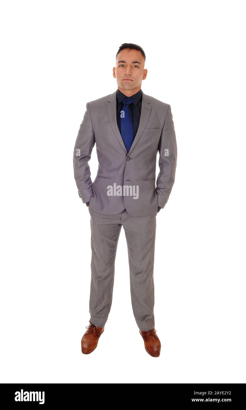 Young man standing in gray suit Stock Photo
