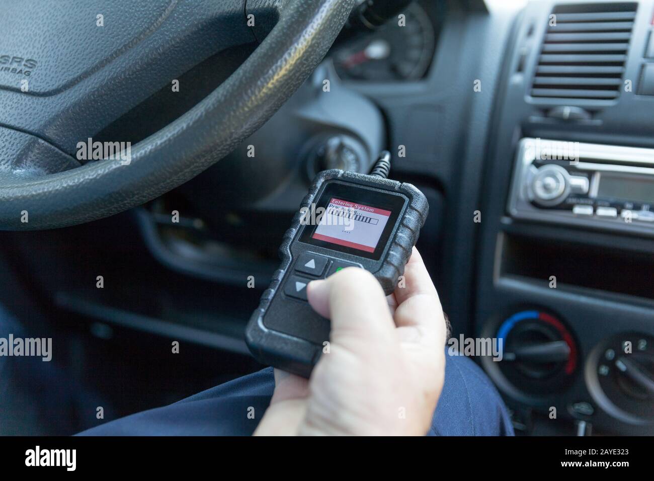 Auto mechanic using car diagnostic scanner tool Stock Photo Alamy