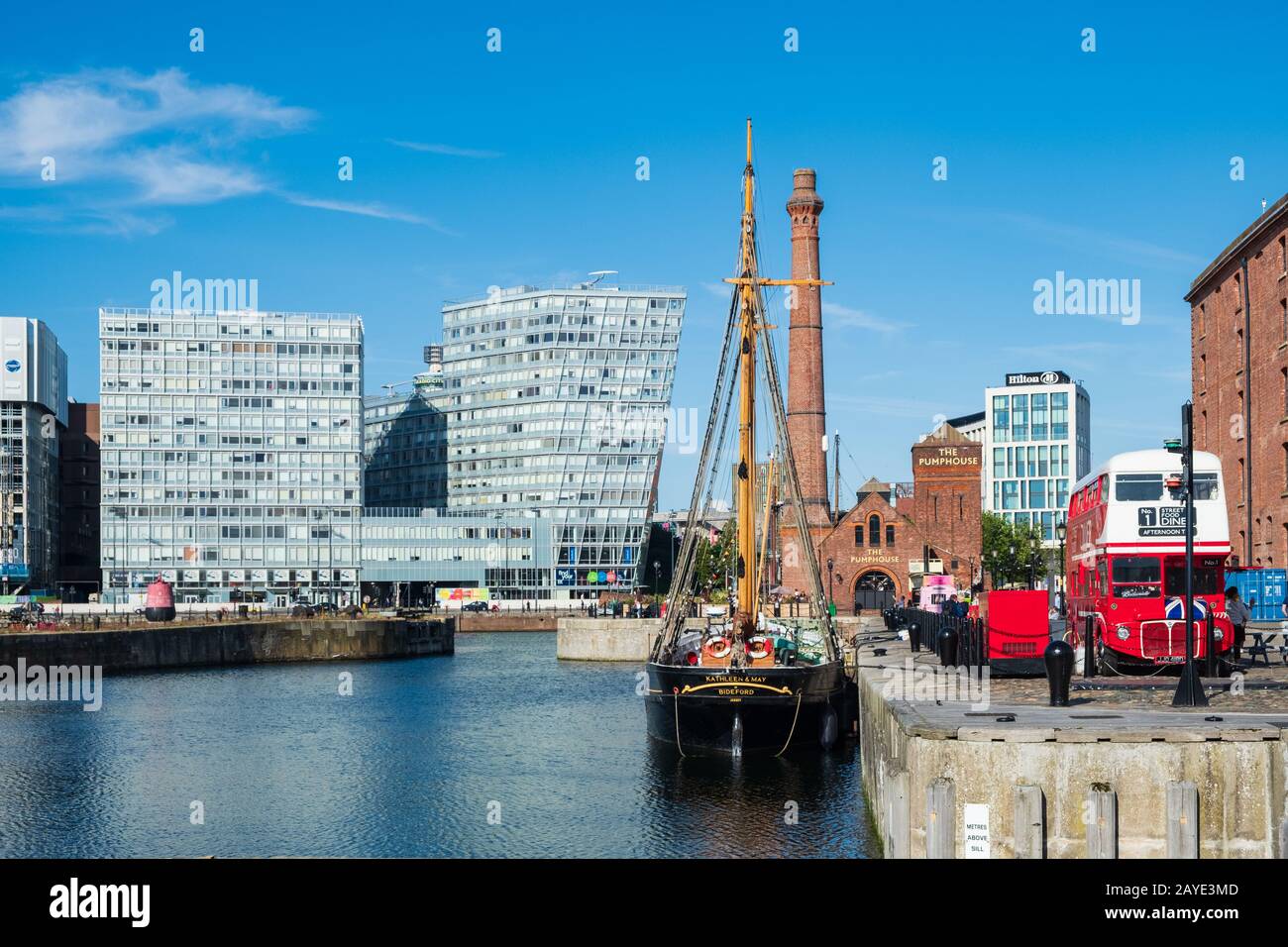Old industrial warehouses and modern office buildings around the waters of Canning Dock in Liverpool's rennovated docklands Stock Photo