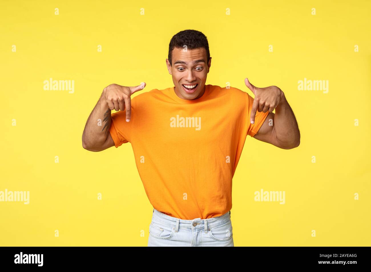 Excited goodlooking handsome hispanic masculine guy, wear orange t