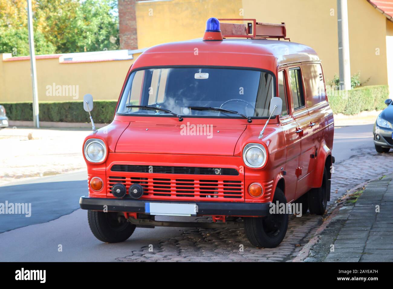 an old discarded fire truck with a slide-in box for the ladder on the roof Stock Photo