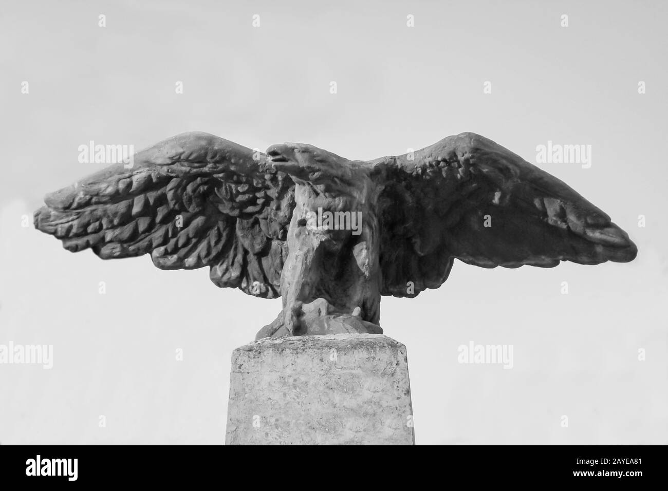 a stone eagle on a pedestal of a statue Stock Photo