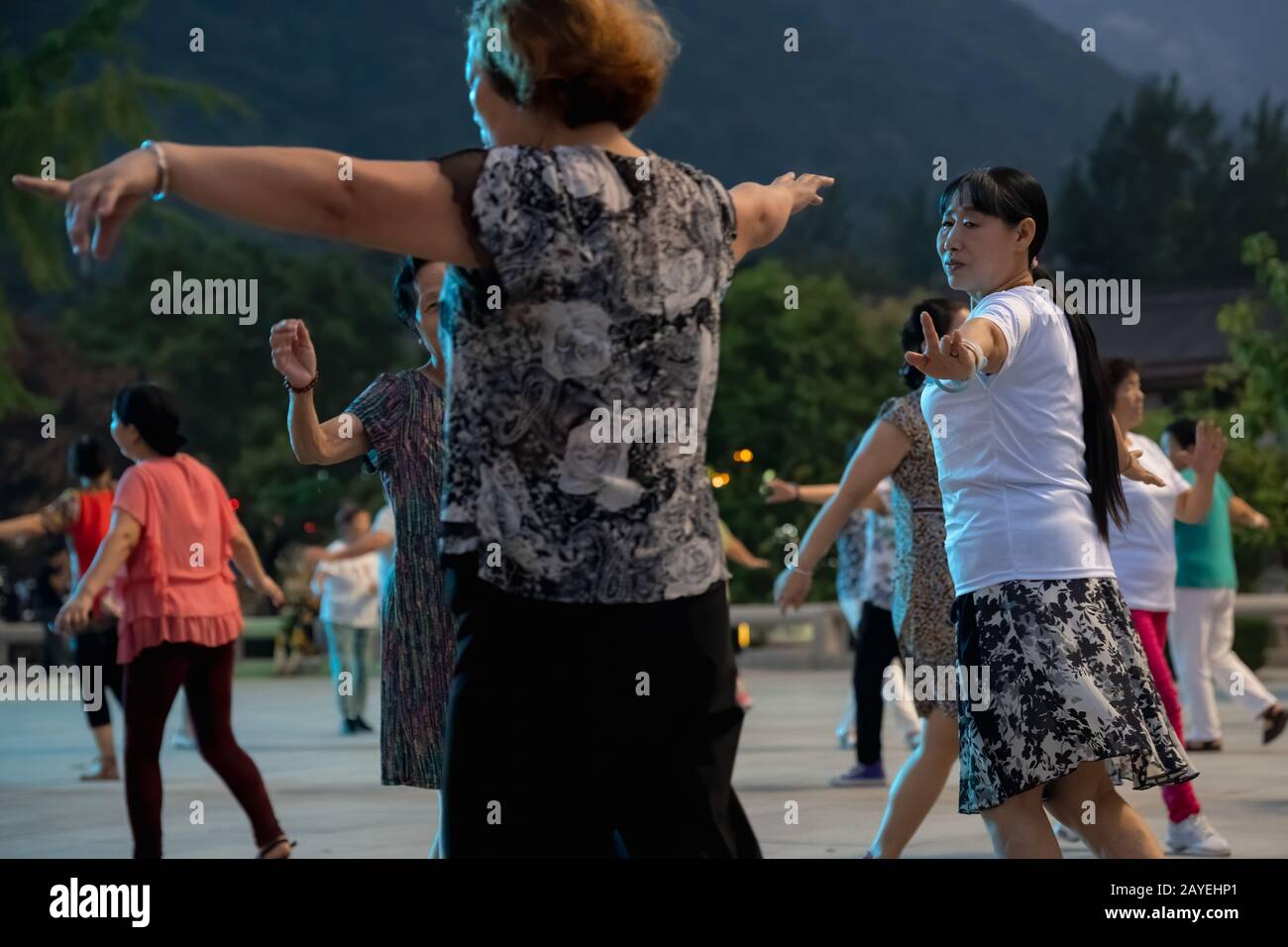 Group of Chinese women dancing in the evening Stock Photo