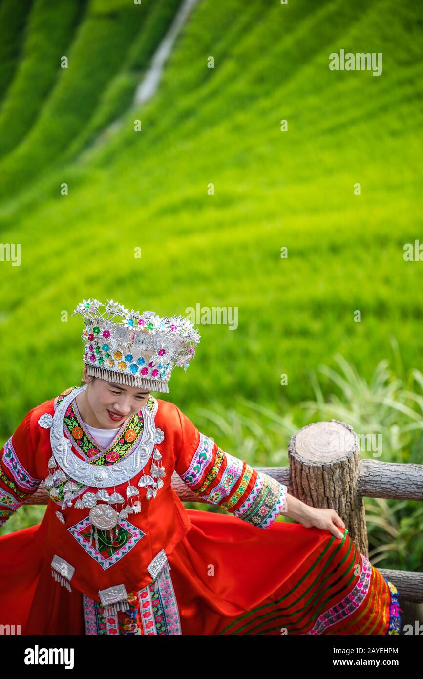 Woman in folk costume Longji Rice Terraces Stock Photo