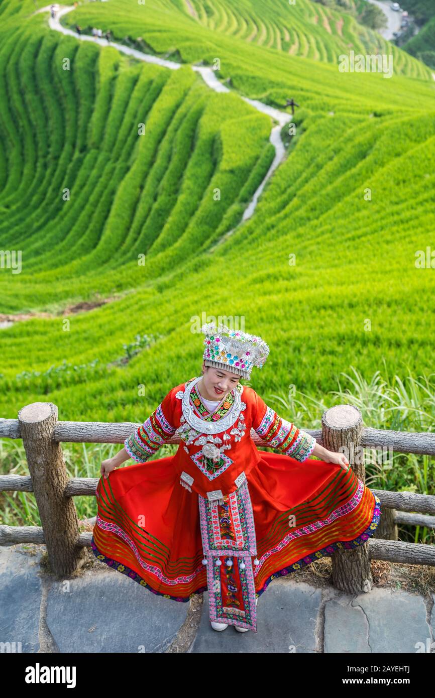 Woman in folk costume Longji Rice Terraces Stock Photo