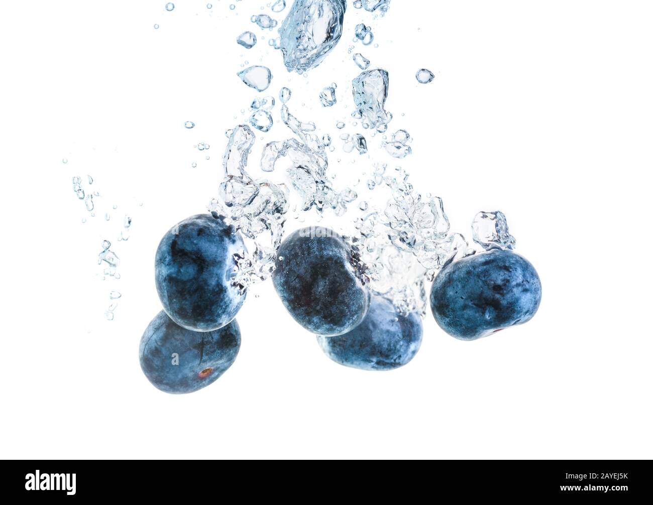 Blueberries sinking underwater. Produkt macro shoot. Berry antioxidant concept on white background. Stock Photo