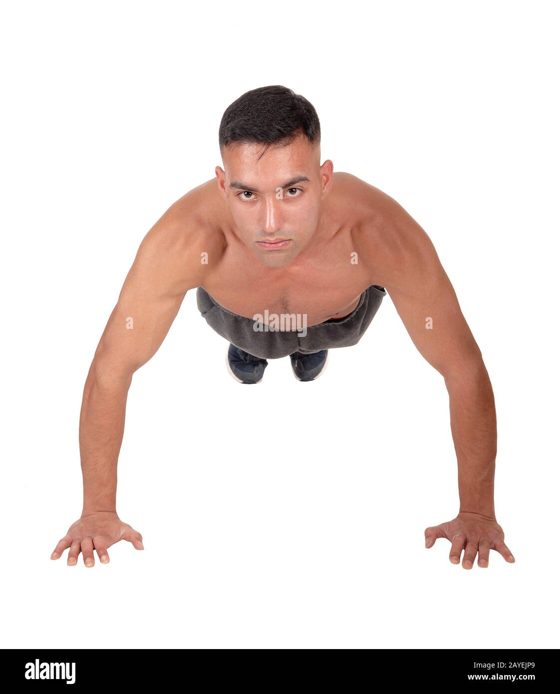 Man doing push aps on the floor in the studio Stock Photo