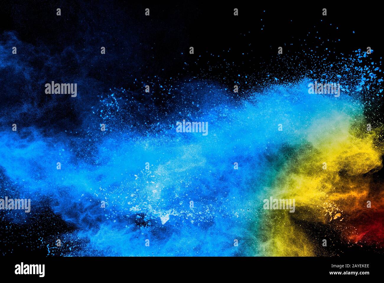 Multicolored powder explosion on black background. Stock Photo