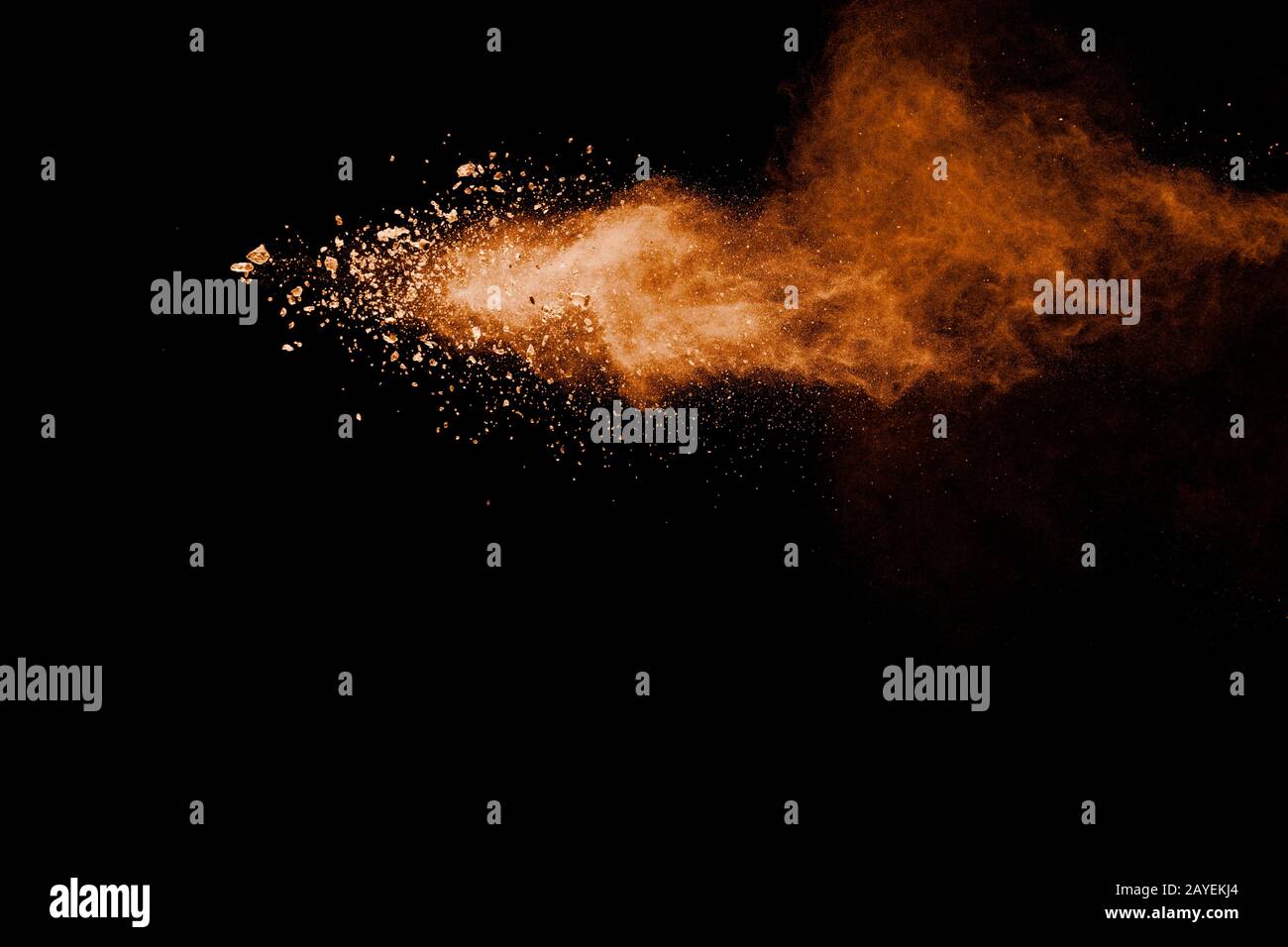 Brown powder explosion on black background. Stock Photo