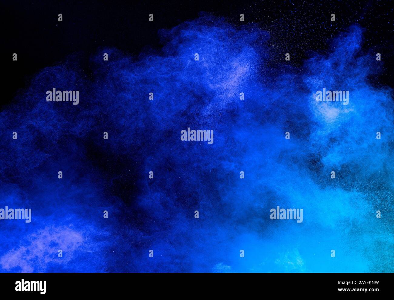 Blue color powder explosion on black background. Stock Photo