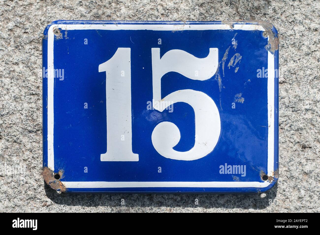 Weathered grunge square metal enameled plate of number of street address with number 15 Stock Photo