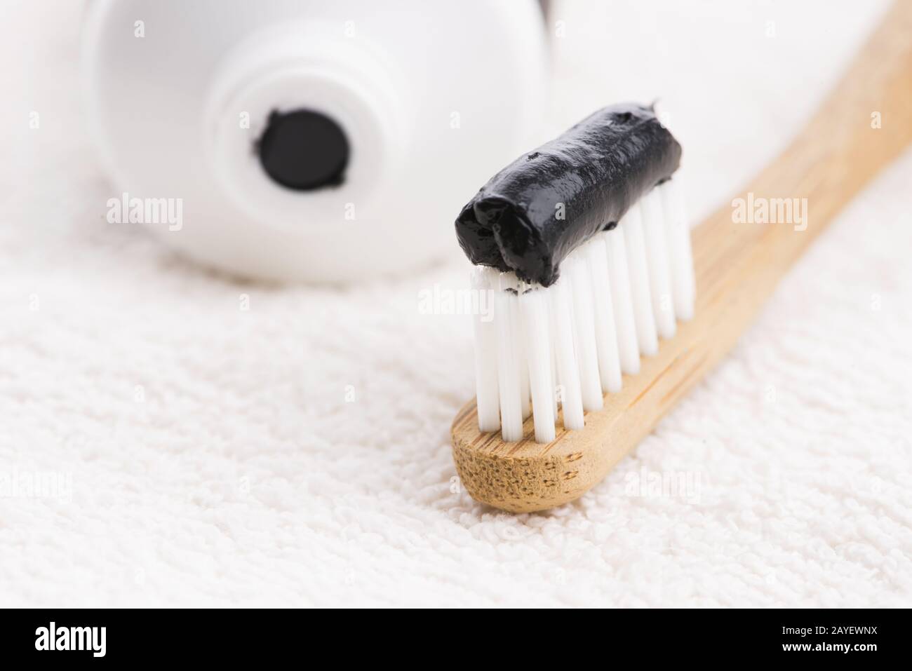Toothbrush with black charcoal toothpaste Stock Photo