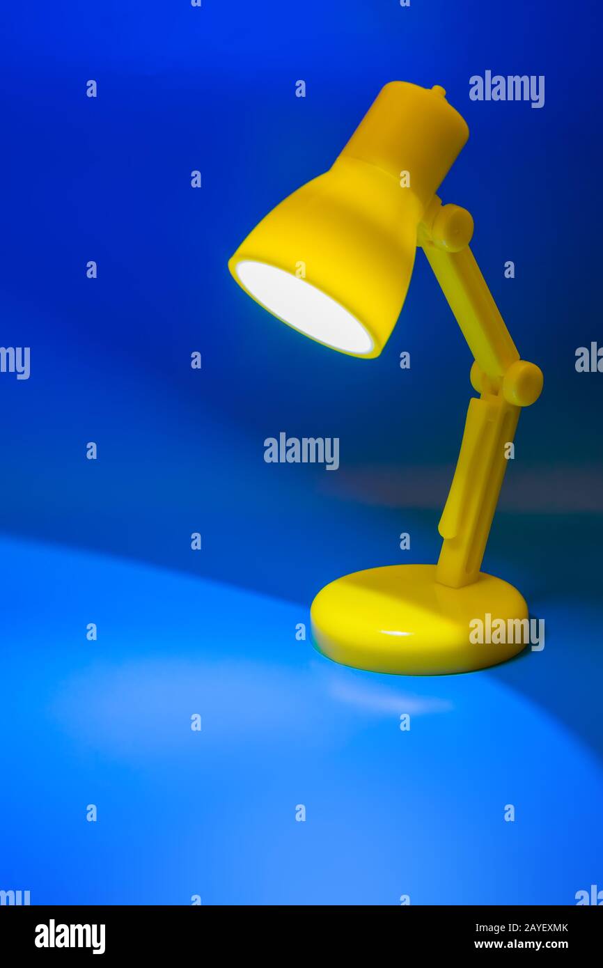 Desk lamp on blue Stock Photo