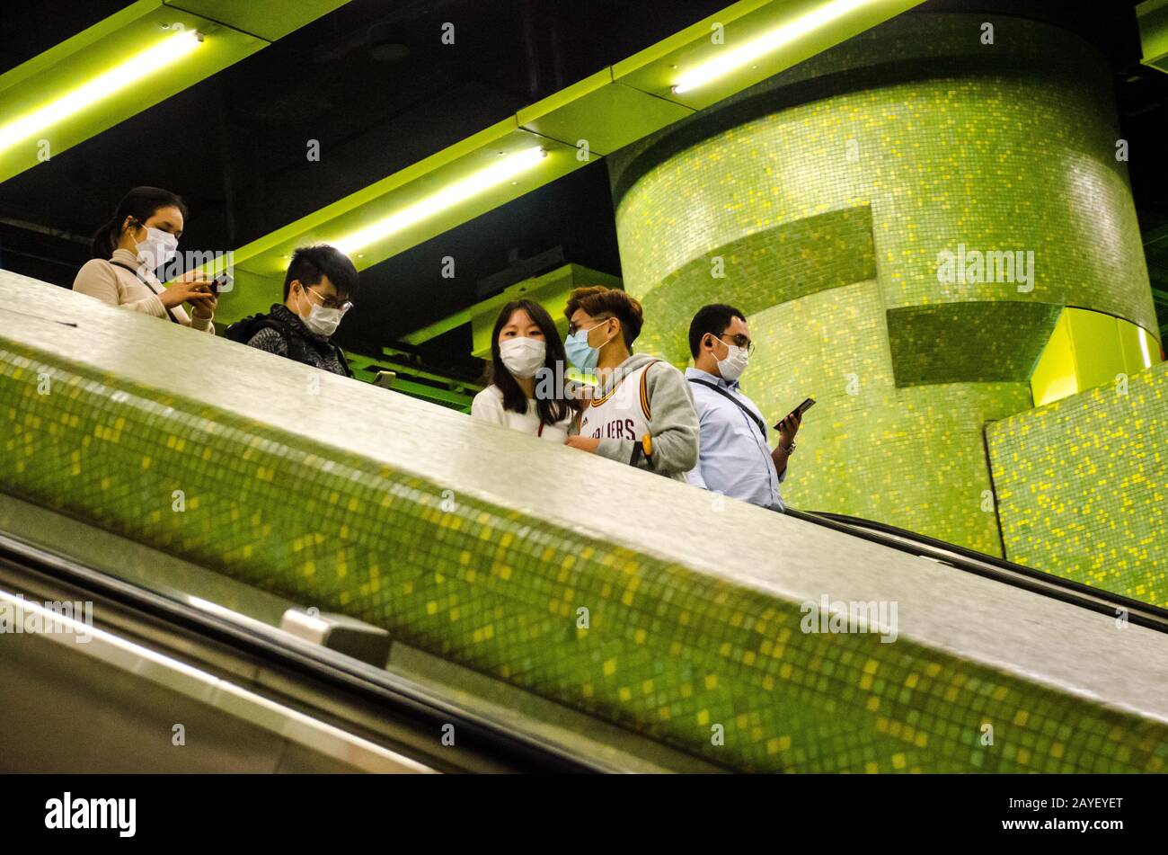 People and commuters wearing face masks in the Metro Mass Transit Railway in Hong Kong during novel coronavirus Covid-19 outbreak February 2020 Stock Photo